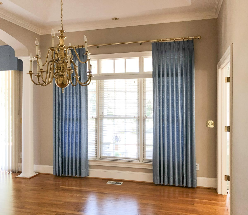 4. Hang Curtains High and Wide